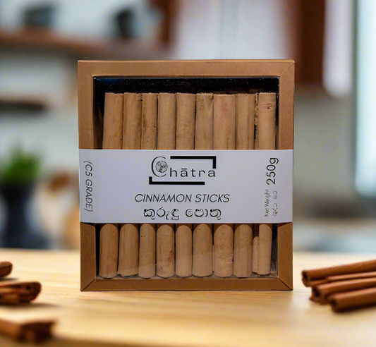 Ceylon Organic House Cinnamon Sticks C5 grade 250g pack on a countertop with Ceylon Cinnamon around